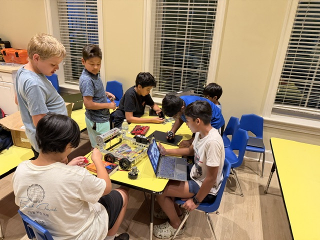 Team members working on the robot